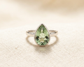Front view of pear-cut green amethyst sterling silver ring in a modern bezel setting.