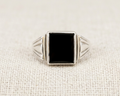 Rectangular black onyx signet ring in sterling silver with geometric grooved detailing on the band